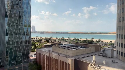 Wall Mural - Aerial high view of Abu Dhabi city (UAE) from downtown, Abu Dhabi corniche road and beach