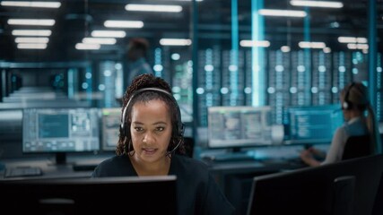 Fototapete - Call Center Office: Portrait of Friendly African American Female Technical Customer Support Specialist Talking on a Headset, uses Computer. Client Experience Officer Helps Online via Video Conference