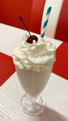 Poster - Vertical shot of a delicious milkshake in a cafe