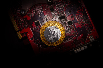 Poster - Top view of Bitcoin coins on a red video card background, Blockchain and bitcoin mining concept