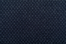 Black Fabric Texture. Furniture Upholstery Textiles. Embossed Pattern. Woven Fibers. The Material Is Soft Touch. Minimalism Concept. High Detail Macro Photography For Backgrounds Or Wallpapers.