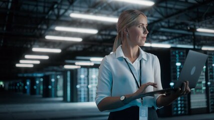 Aufkleber - Successful Female Chief Technology Officer Using Laptop Computer, Standing in Big Warehouse Data Center. System Administrator Maintenance of SAAS, Cloud Services Server. Digital Entrepreneur. Static