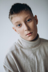 Close up portrait of handsome teenage boy posing on isolated background