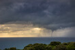 Tornadic waterspout on the sea on a stormy day