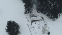 Drone View To Covered By Snow Ancient Fishing Village During Flying Heavy Snowing. Open Air Museum, Riga, Latvia.