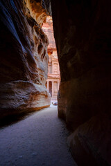 Poster - Vertical shot of a narrow pathway between the rock in the historic Petra Wadi, Jordan