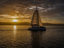 Sailboat During A Golden Sunset In Knysna Lagoon Garden Route