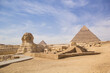 © marinadatsenko - Great Sphinx against the background of the pyramids of the pharaohs Cheops, Khafren, and Mikerin in Giza, Egypt