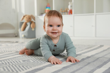 Wall Mural - Cute baby crawling on floor at home