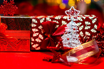 Canvas Print - Christmas decorations and ornaments on a red table