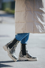 Sticker - Closeup of fashionable female boots on a woman