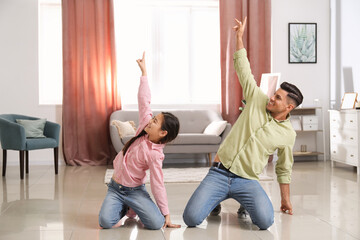 Canvas Print - Man and his little daughter dancing at home