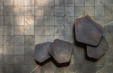 Table and benches set made of wooden on leisure corner. Concept of Place to sit and relax, design furniture made of wooden, Top view, Copy space, Selective focus.