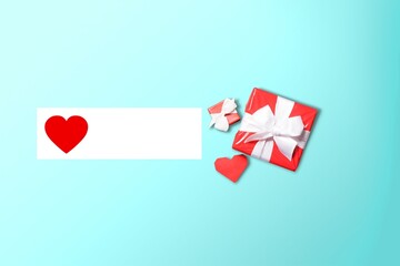 Sticker - Card, gift box, red heart on blue background.