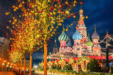 Moscow Christmas. Russia Winter. St. Basil's Cathedral On Christmas Night. Winter Evening On Red Square. New Year's Fair In Front Of Kremlin. Tour To Russia. Travel To Moscow. Trees With Garlands