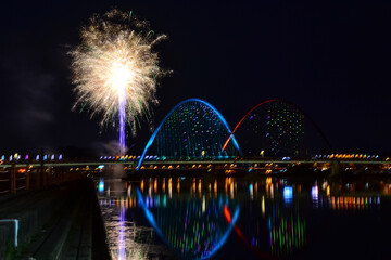 Night shot of the Expo Bridge with fireworks in Daejeon, South Korea.