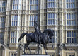View of Richard the lionheart statue outside the houses of Parliament in London, UK