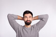 © Tetiana - Top above high angle view photo of young man look empty space arms behind head relax isolated over grey color background