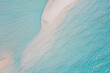 Aerial view of sandbar and blue sea. Maldivian sandbank in Indian ocean, white sandy coast crystal azure color water, perfect getaway for tropical vacations. Top aerial view, calm waves, surf relax