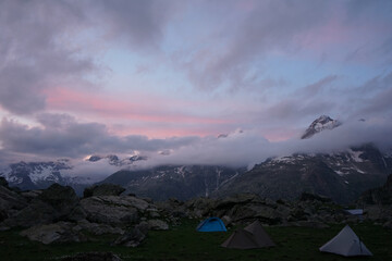 Poster - Scenic view of a mountainous landscape during a bright sunset