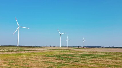 Canvas Print - Alternative renewable energy concept, windmill turbines in the field. Aerial view of rotating windmill power generator