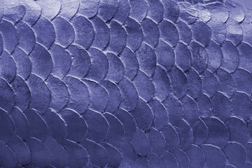 Close up pattern of mermaid or fish scales tiles toned in trendy color of the 2022 year