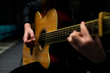 Sticker - Shallow focus of a man playing the guitar