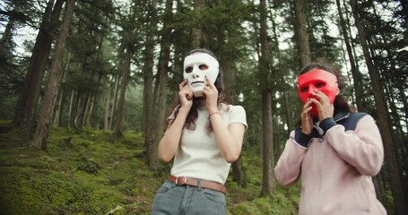 Poster - An Indian friends wearing a white party face mask in the garden