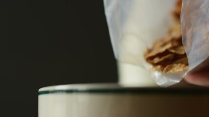 Canvas Print - A man making oat flakes as a morning breakfast