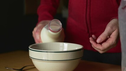 Sticker - A man making oat flakes with milk as a morning breakfast