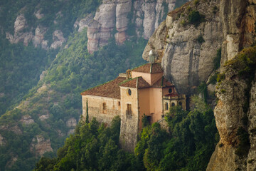 Sticker - Mesmerizing view of Santa Cova chapel on the mountain Montserrat in Barcelona, Spain