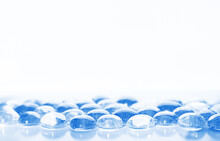 Blue Glass Pebbles On A White Background