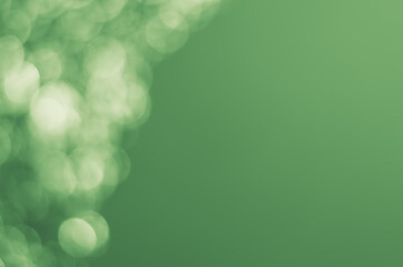 Wall Mural - green background with defocused lights