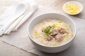 Wall Mural - Close up Rice porridge ,congee with minced pork and ginger in white bowl