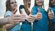 © Довидович Михаил - A group of girls girlfriends show thumbs up.