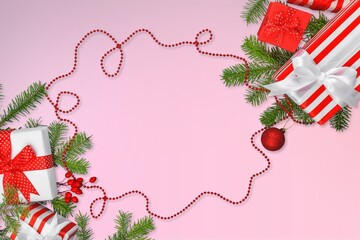 Wall Mural - Christmas composition. Colored decorations, gifts on a pastel pink background.