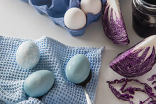 Dyed Blue Easter Eggs Painted With Natural Dye Red Cabbage On White Background.