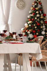 Poster - Festive dinner with delicious food and wine on table indoors. Christmas Eve celebration