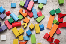 Colorful Wooden Building Blocks On Carpet, Flat Lay