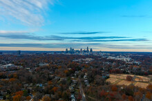 A Gorgeous Aerial Shot Of The Downtown Cityscape With Skyscrapers And Vast Miles Of Autumn Colored Trees With Blue Sky And Clouds At Freedom Park In Charlotte North Carolina USA