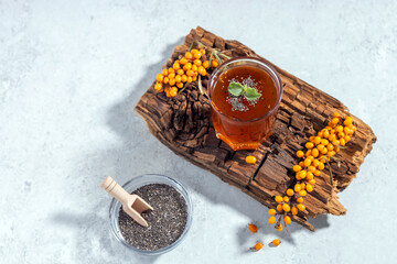 Wall Mural - homemade marmalade from hawthorn berries with chia seeds on a wooden board. top view