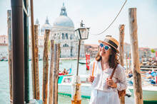 Woman In White Clothes With Straw Hat At Pier Basilica Santa Maria Della Salute On Background