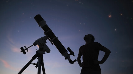 Wall Mural - silhouette of a man, telescope and countryside under the starry skies.