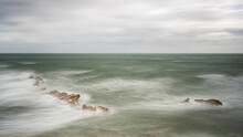 Waves Washing Over The Jagged Rocks At Peveril Point, Dorset On The English South Coast. 
