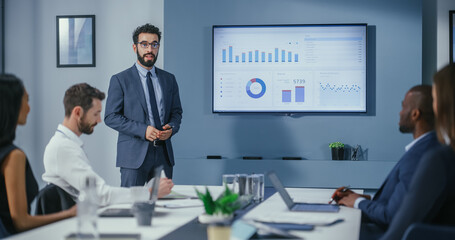 Leinwandbilder - Office Conference Room Meeting: Digital Enterpreneur Presents e-Commerce Investment Strategy for Group of Investors. Wall TV Showing Big Data Analysis, Infographics, Stock Market Information, Trends