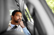 © Syda Productions - transportation and people concept - dreaming indian male passenger in taxi car