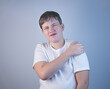 © asokova - A young man suffering from shoulder pain. Concept disease. Pain in the shoulder joint, muscle pain. Pain in the shoulder joint. The cause of the disease is tension, stress or injury. Copy Space
