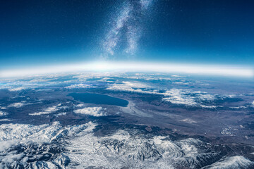  View of stars and milkyway above Earth from space. Beautiful space view of the Earth with cloud formation