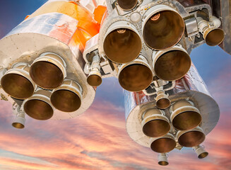 Wall Mural - space rocket engines of the russian spacecraft over blue sky background