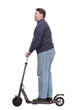 © ASDF - full-length. mature man with an electric scooter.